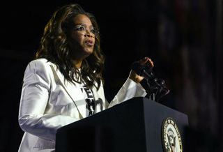 Democratic presidential nominee, U.S. Vice President Kamala Harris (R) speaks alongside Oprah Winfrey during the closing rally of her campaign at the base of the iconic "Rocky Steps" at the Philadelphia Museum of Art on November 05, 2024 in Philadelphia, Pennsylvania. With one day to go until election day, Vice President Kamala Harris is campaigning across Pennsylvania.