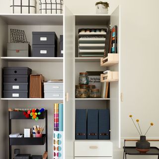 home office storage cupboard with boxes, trolley and folders