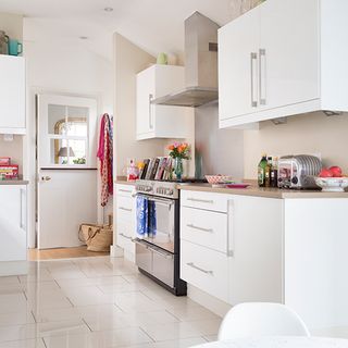 kitchen with cabinet and white flooring