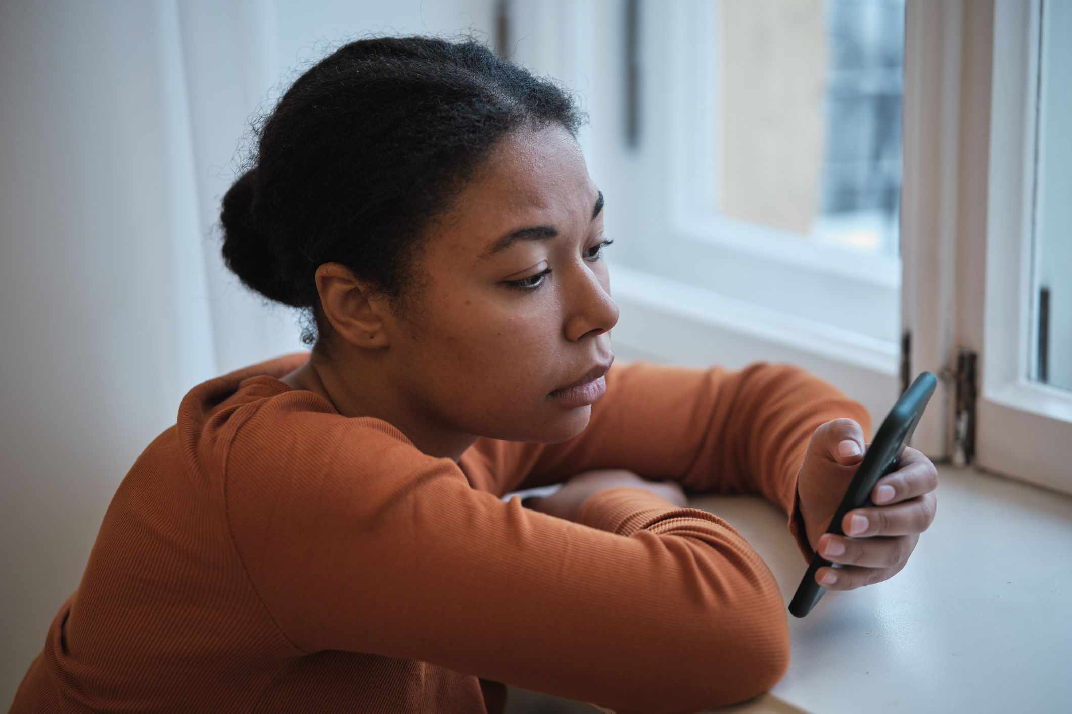 Woman using smartphone at home