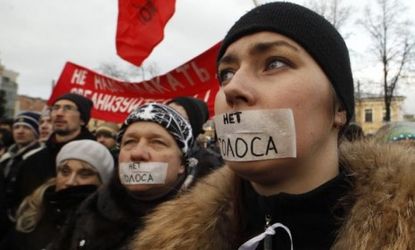 Russian protesters wear tape that reads, "No voice (vote)": Despite the fierce opposition, some Russia watchers believe Vladimir Putin will win his battle against angry demonstrators.