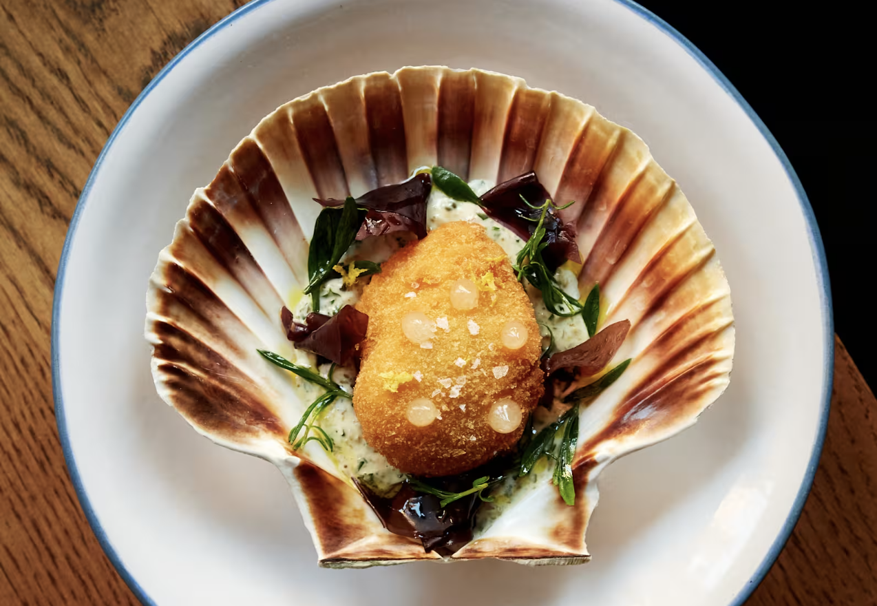 an image of the Orkney scallop on offer at Willett's which is breaded and sitting in a white sauce