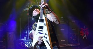 Michael Schenker plays a solo on his white Gibson Flying V – all on his left-hand, legato-style