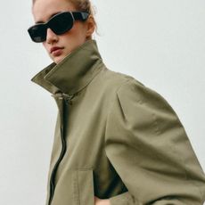 Model wears green khaki jacket
