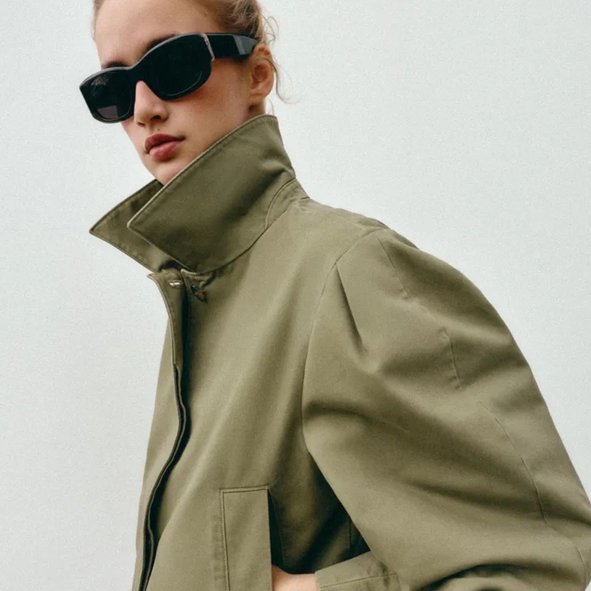 Model wears green khaki jacket