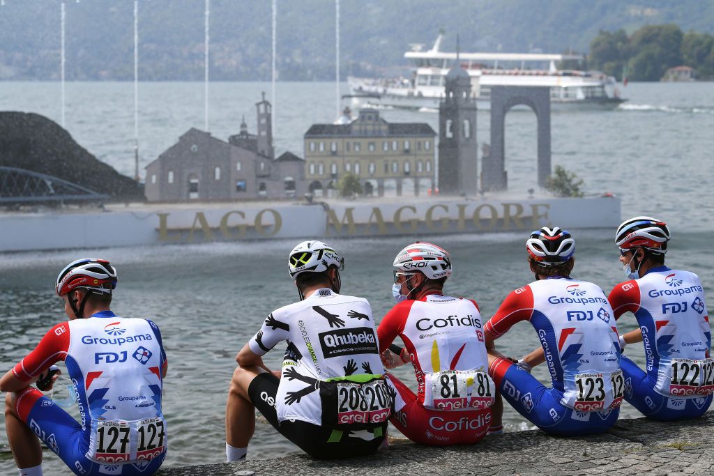 VALLE SPLUGA ALPE MOTTA ITALY MAY 29 Attila Valter of Hungary and Team Groupama FDJ Lukasz Wisniowski of Poland and Team Qhubeka Assos Elia Viviani of Italy and Team Cofidis Antoine Duchesne of Canada and Team Groupama FDJ in Maggiore Lake at start in Verbania City during the 104th Giro dItalia 2021 Stage 20 a 164km stage from Verbania to Valle Spluga Alpe Motta 1727m UCIworldtour girodiitalia Giro on May 29 2021 in Valle Spluga Alpe Motta Italy Photo by Tim de WaeleGetty Images