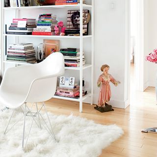 shelving with white walls and chair