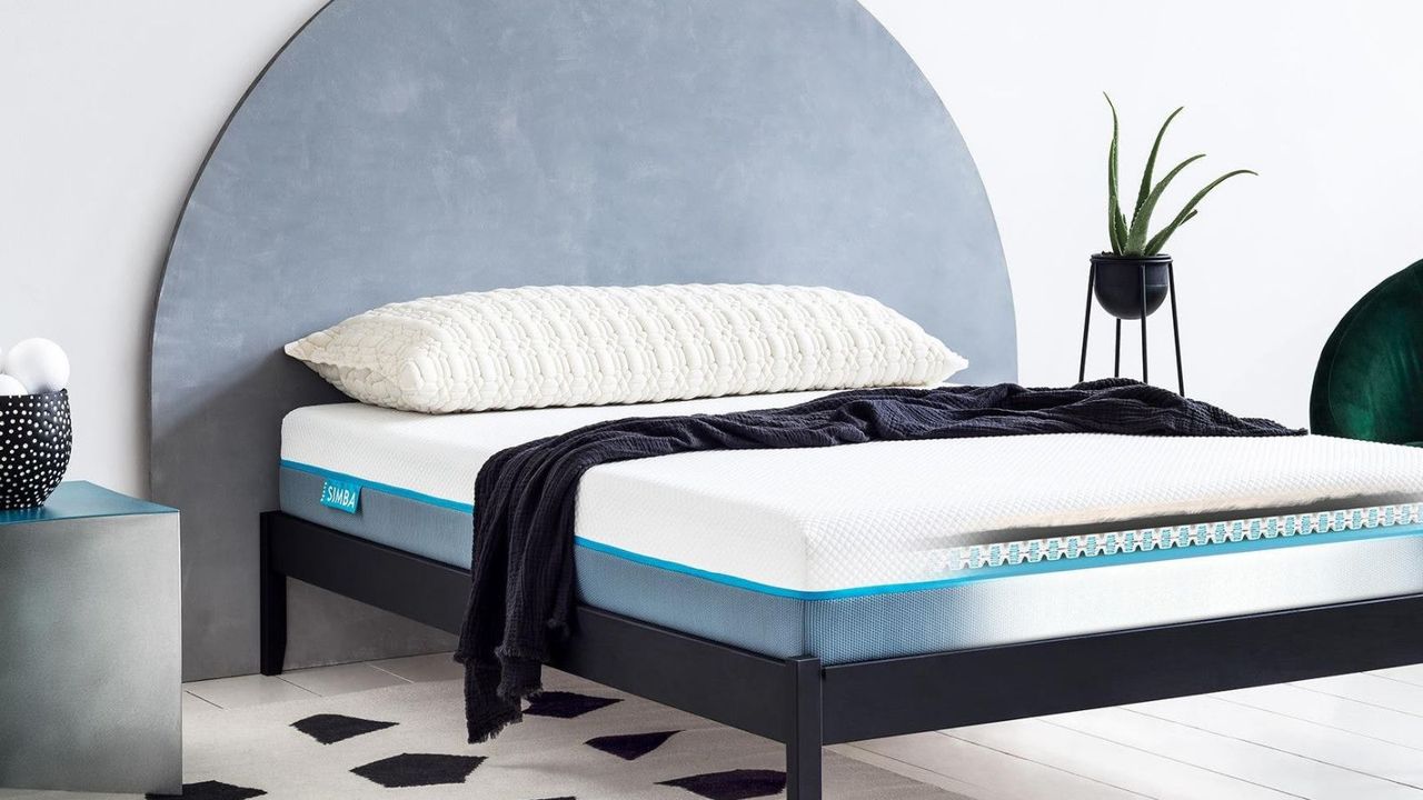 Simba Hybrid Pro Mattress on a bed against a white wall. 