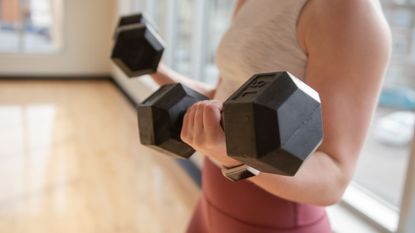 A woman performing bicep exercises, including bicep curls