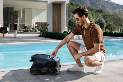 Beatbot AquaSense 2 Ultra owners relaxing while the robotic pool cleaner clears the pool.