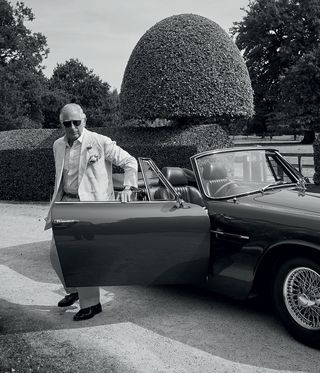 Prince Charles with his Aston Martin DB6 MKII Volante