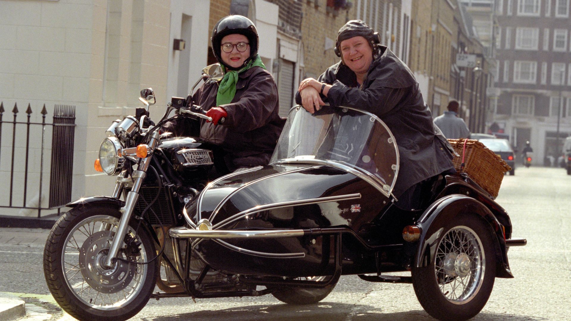 Jennifer Paterson and Clarissa Dickson Wright on their motorbike and sidecar