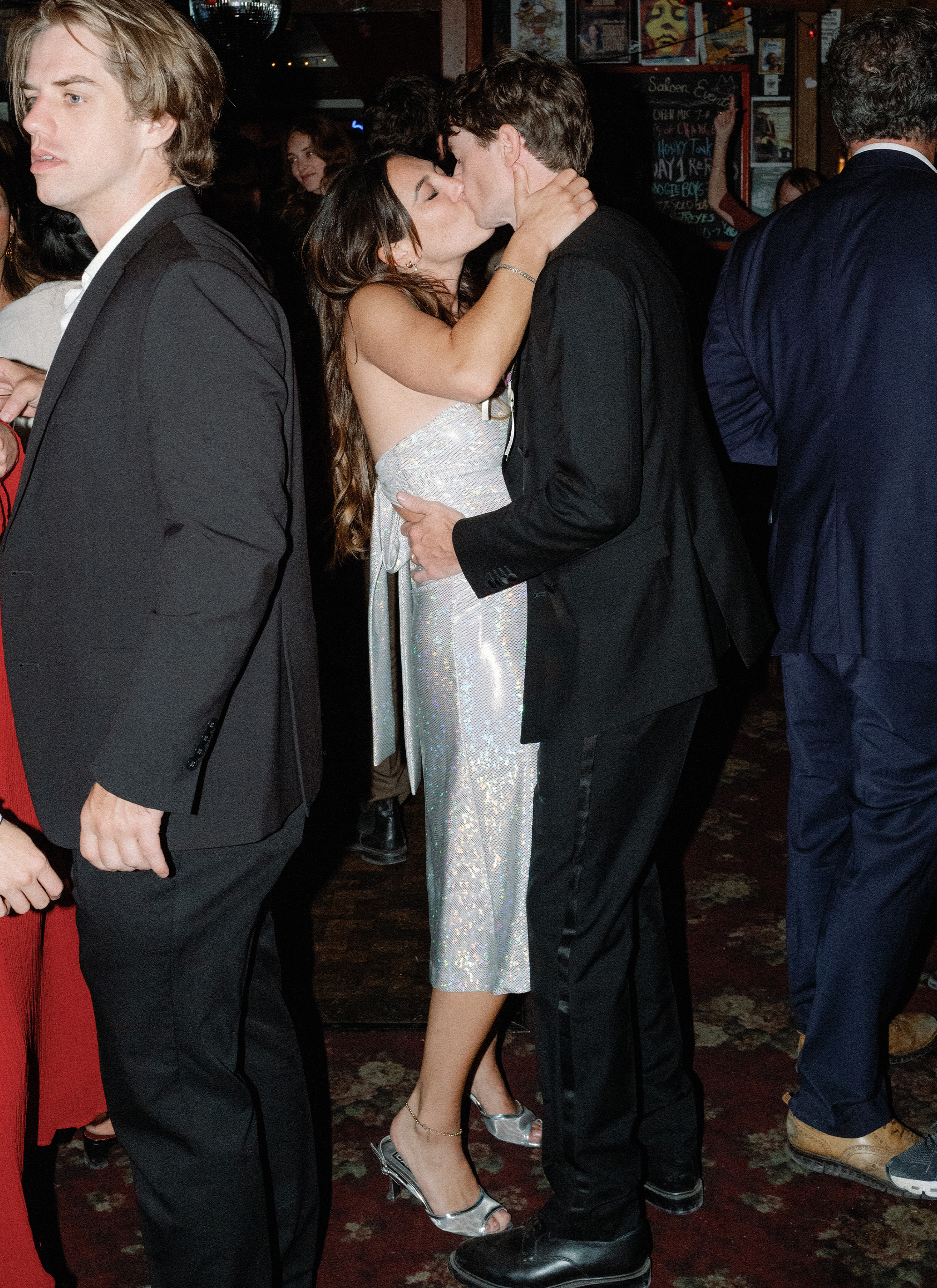 Charles and Hadley kissing.