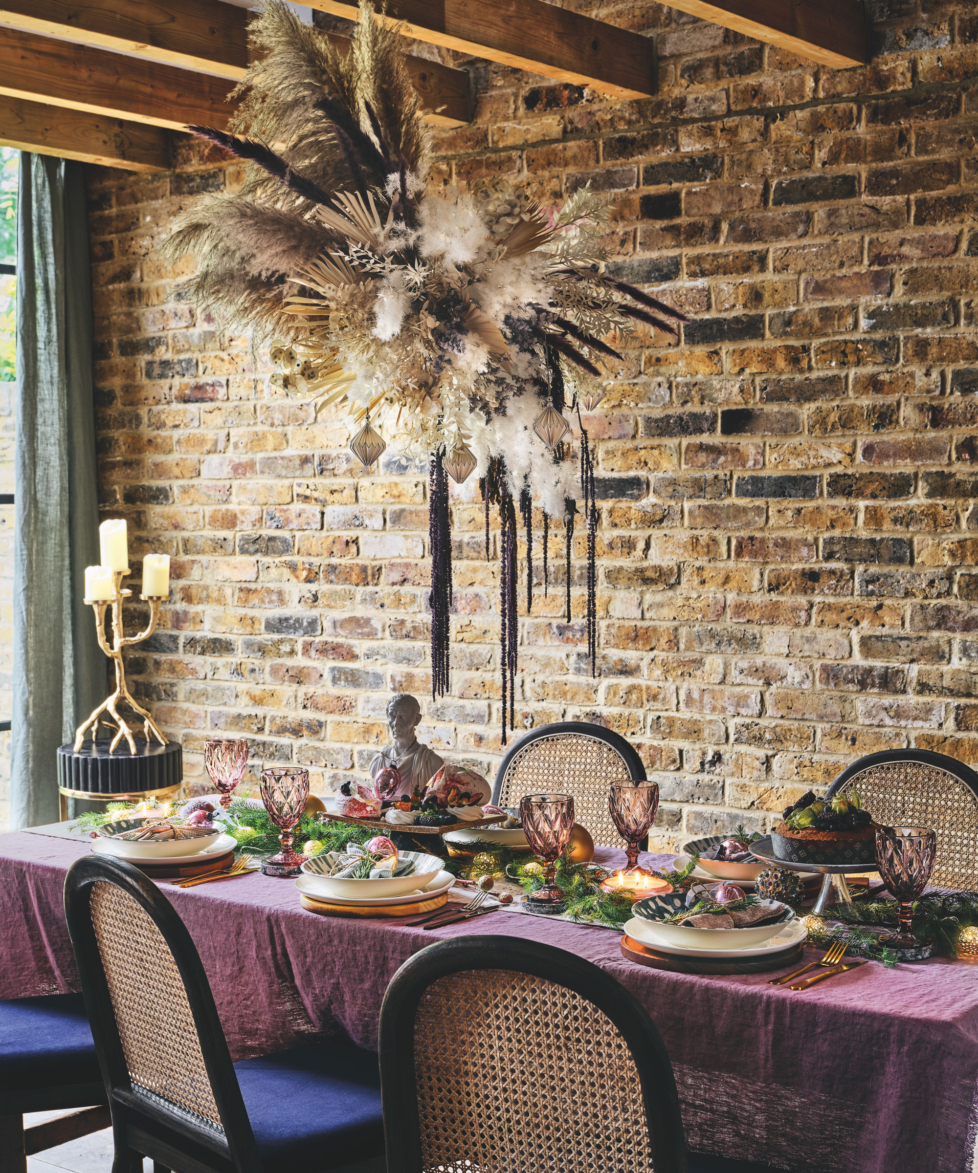 Christmas dinner table with dried floral display