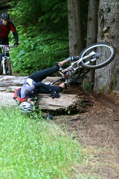 A rider has a hard time navigating between two trees
