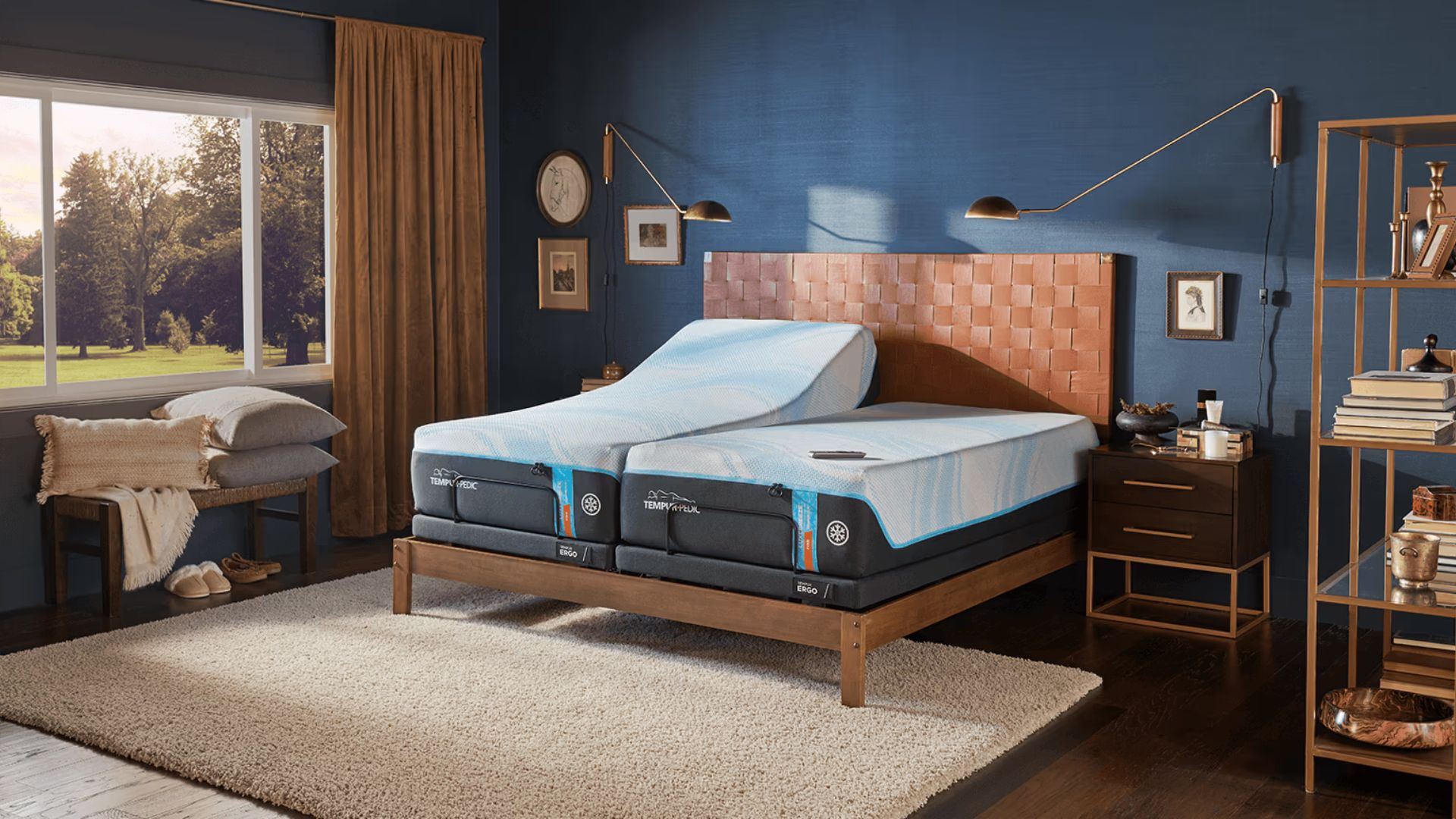 A blue bedroom containing the Tempur-Ergo smart in a split king