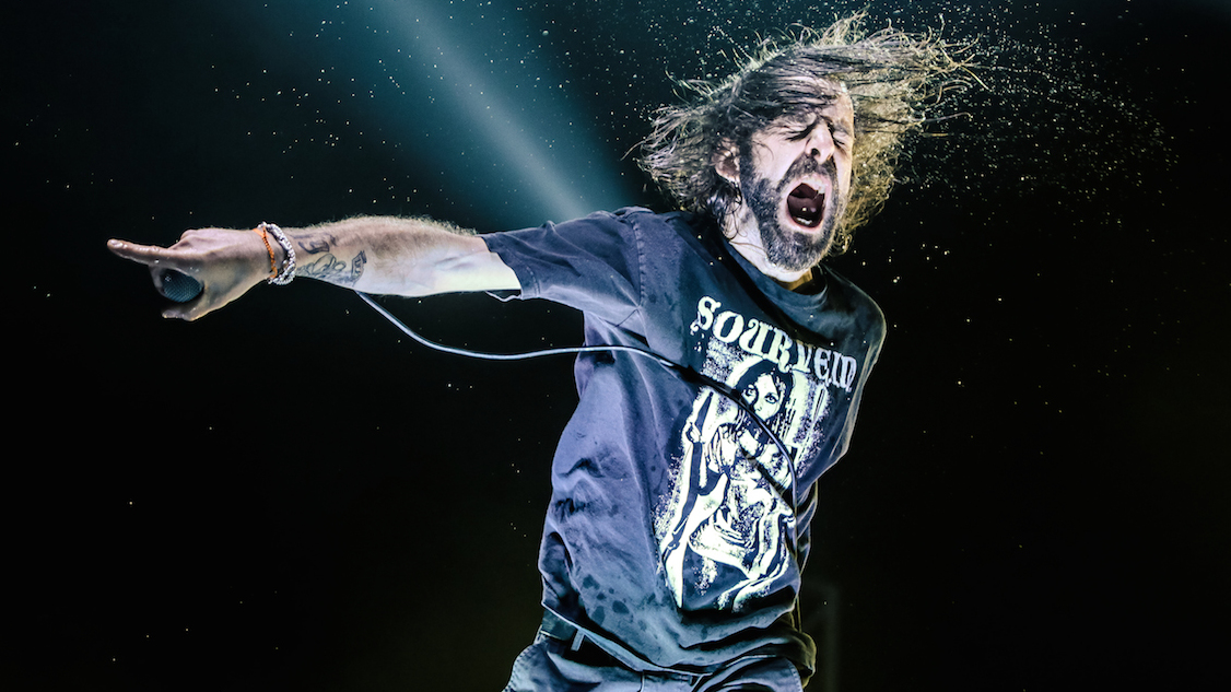 Lamb Of God&#039;s Randy Blythe onstage screaming and pointing