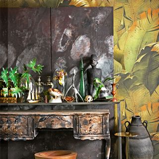 hallway with distressed sideboard and wallpaper on wall