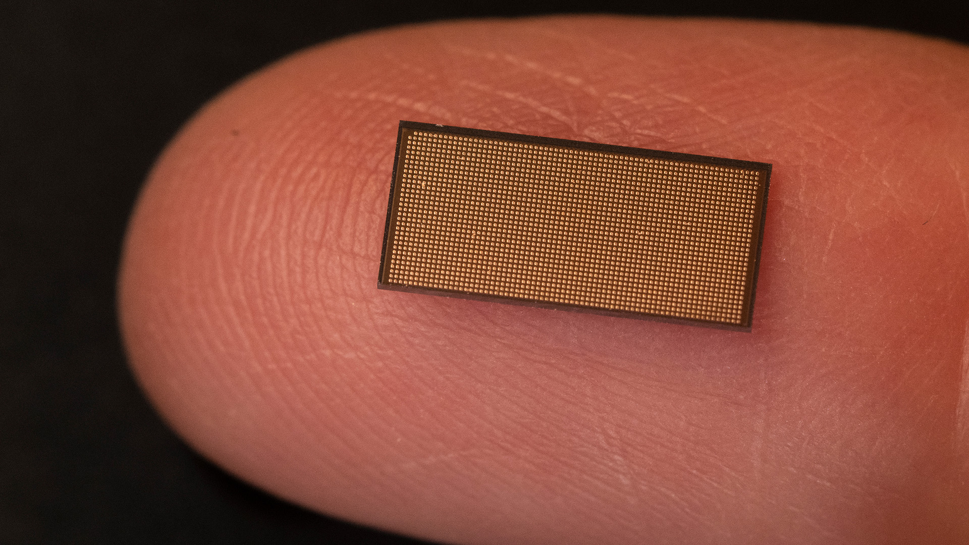 Intel's Loihi 2 chip on the tip of a finger