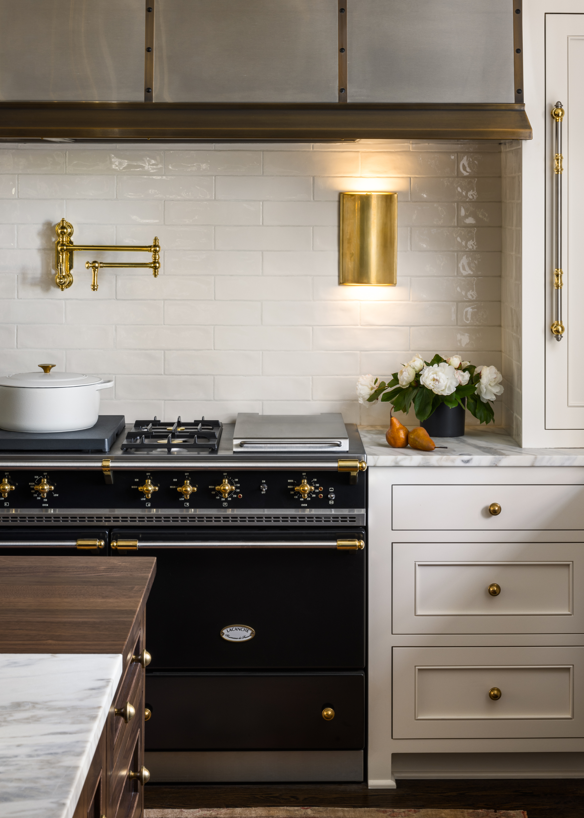 A kitchen with a pot filler tap