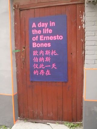 Purple poster with "A day in the life of Ernesto Bones" in pink text