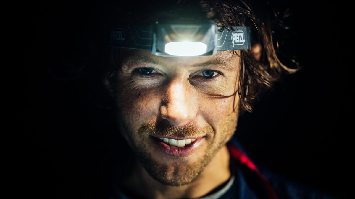 Hiker wearing Petzl Tikkina headlamp