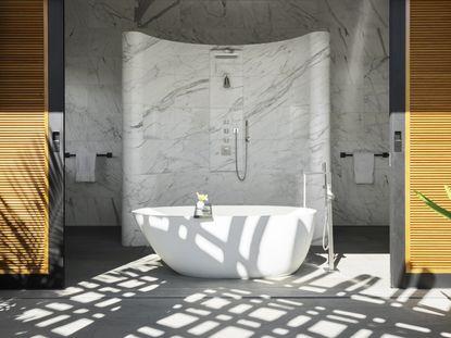 An indoor/outdoor bathroom with wooden cladding and white marble
