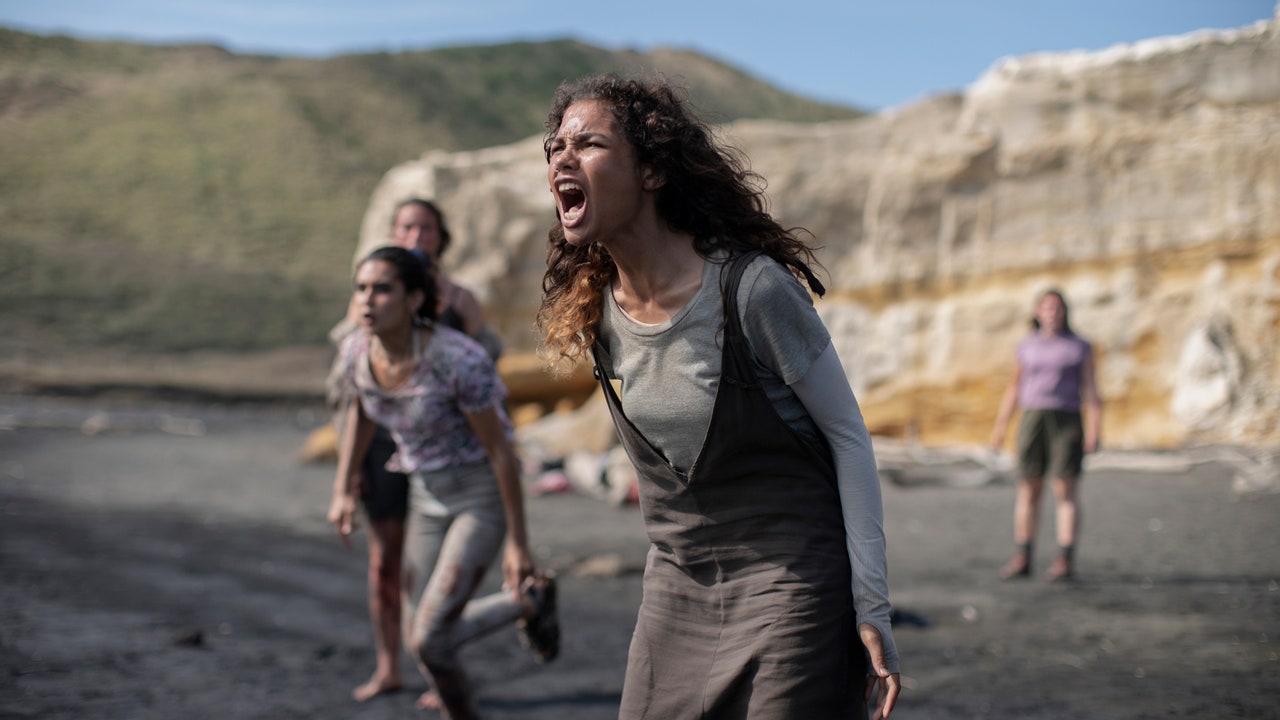 A girl screams for help as she stands on a beach in The Wilds season 1 on prime Video