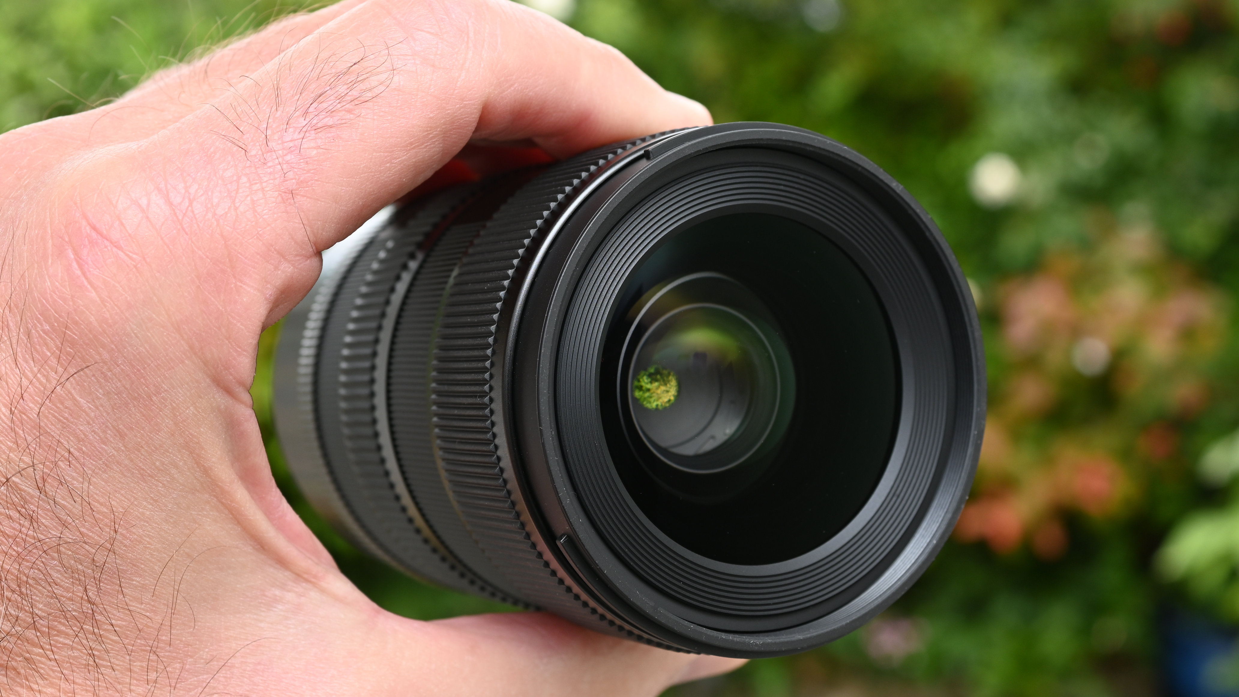 Sigma 17-40mm f/1.8 DC | A product shot held in hand