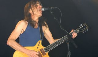 Malcolm Young performs onstage with AC/DC at the Roseland Ballroom