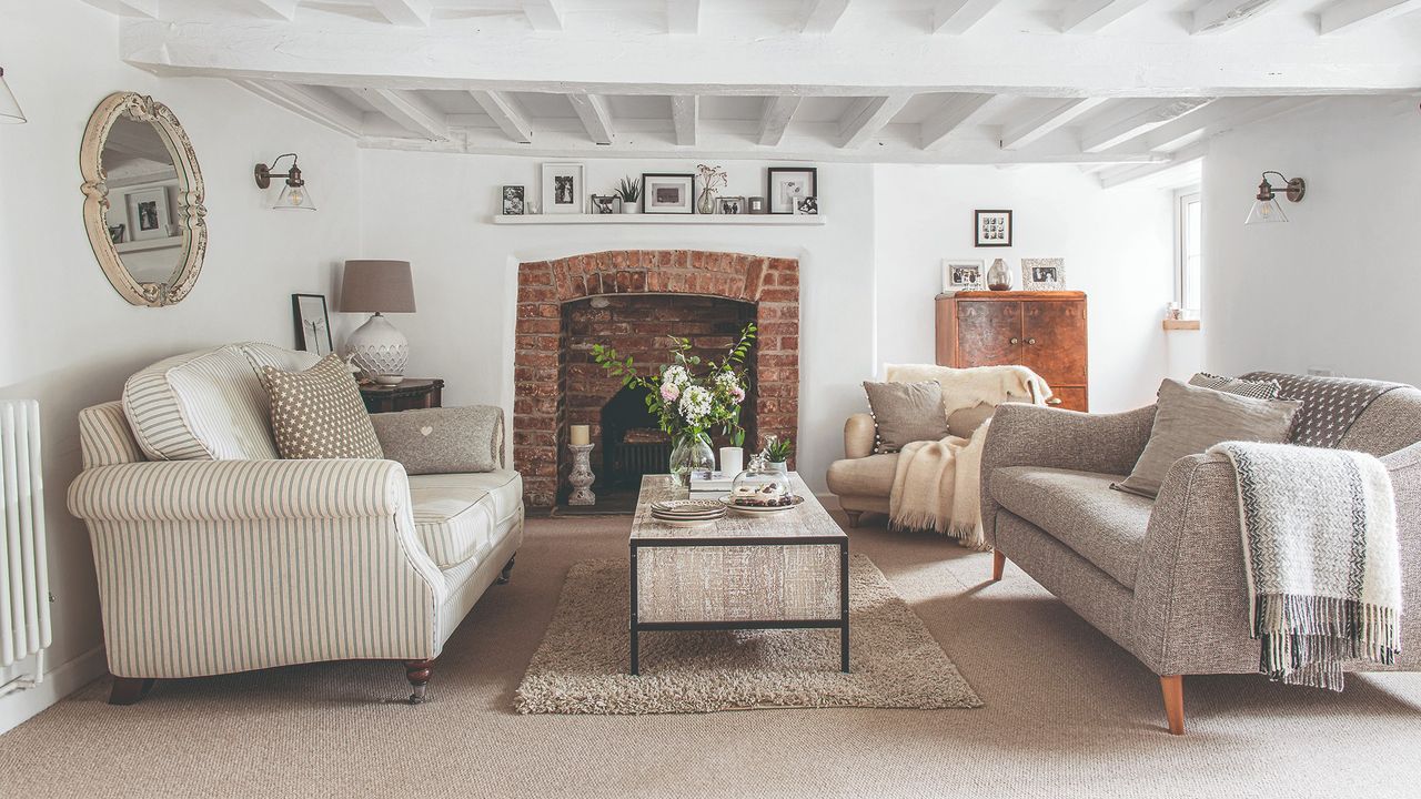 living room with white wall and fireplace