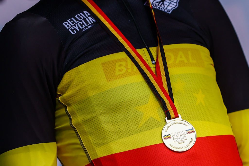 The Belgian champion&#039;s jersey and gold medal on Michael Vanthourenhout