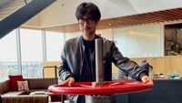 Hideo Kojima poses with various objects at Valve Software's offices.