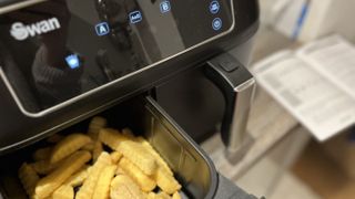 swan duo digital air fryer loaded up with frozen chips pre cooking