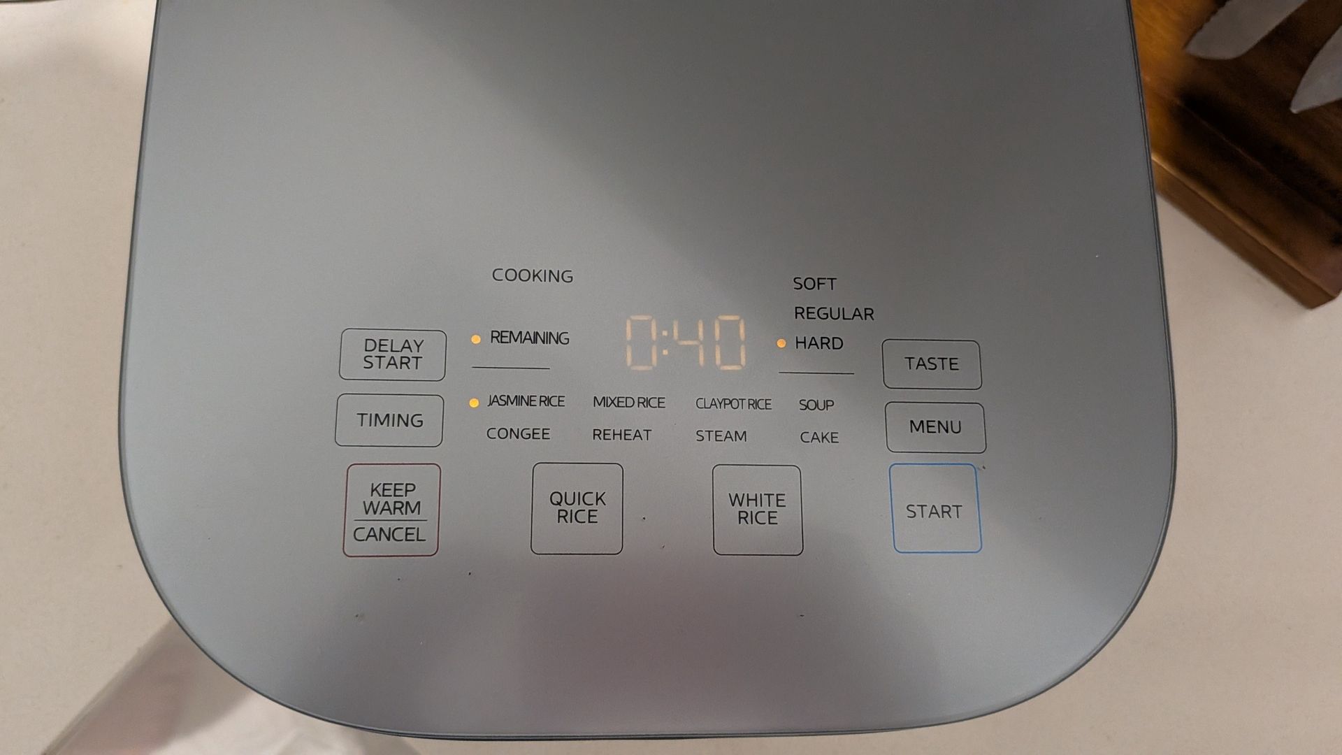Midea 5L Induction Rice Cooker's lid showing its buttons and indicator LEDs