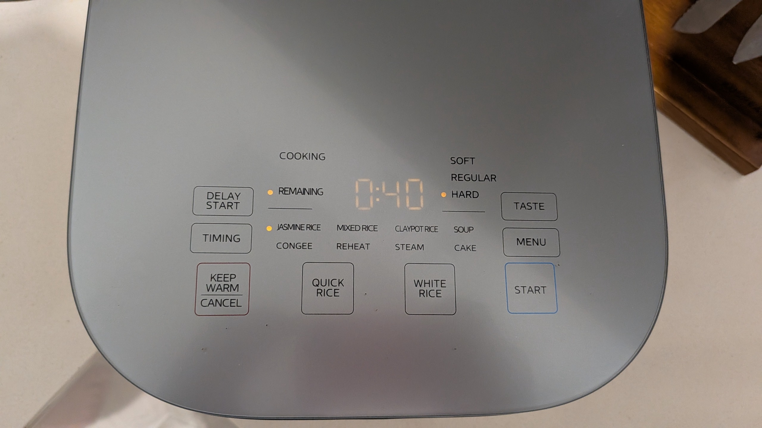 Midea 5L Induction Rice Cooker's lid showing its buttons and indicator LEDs
