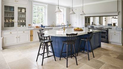 white kitchen with blue kitchen island by Martin Moore