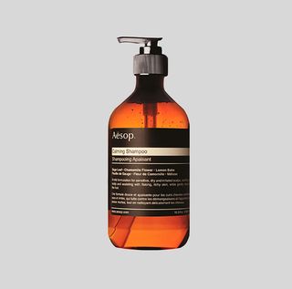 brown glass bottle of Aesop shampoo