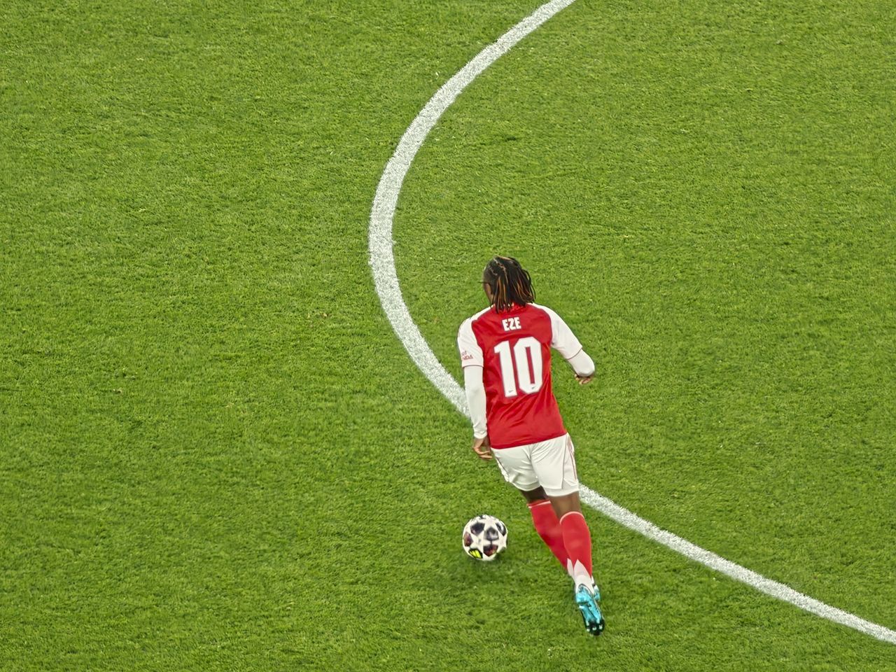 A Champions League soccer match between Arsenal and Atletico Madrid, as seen from the upper stand at the Emirates stadium, London. Zoomed in photos of the players