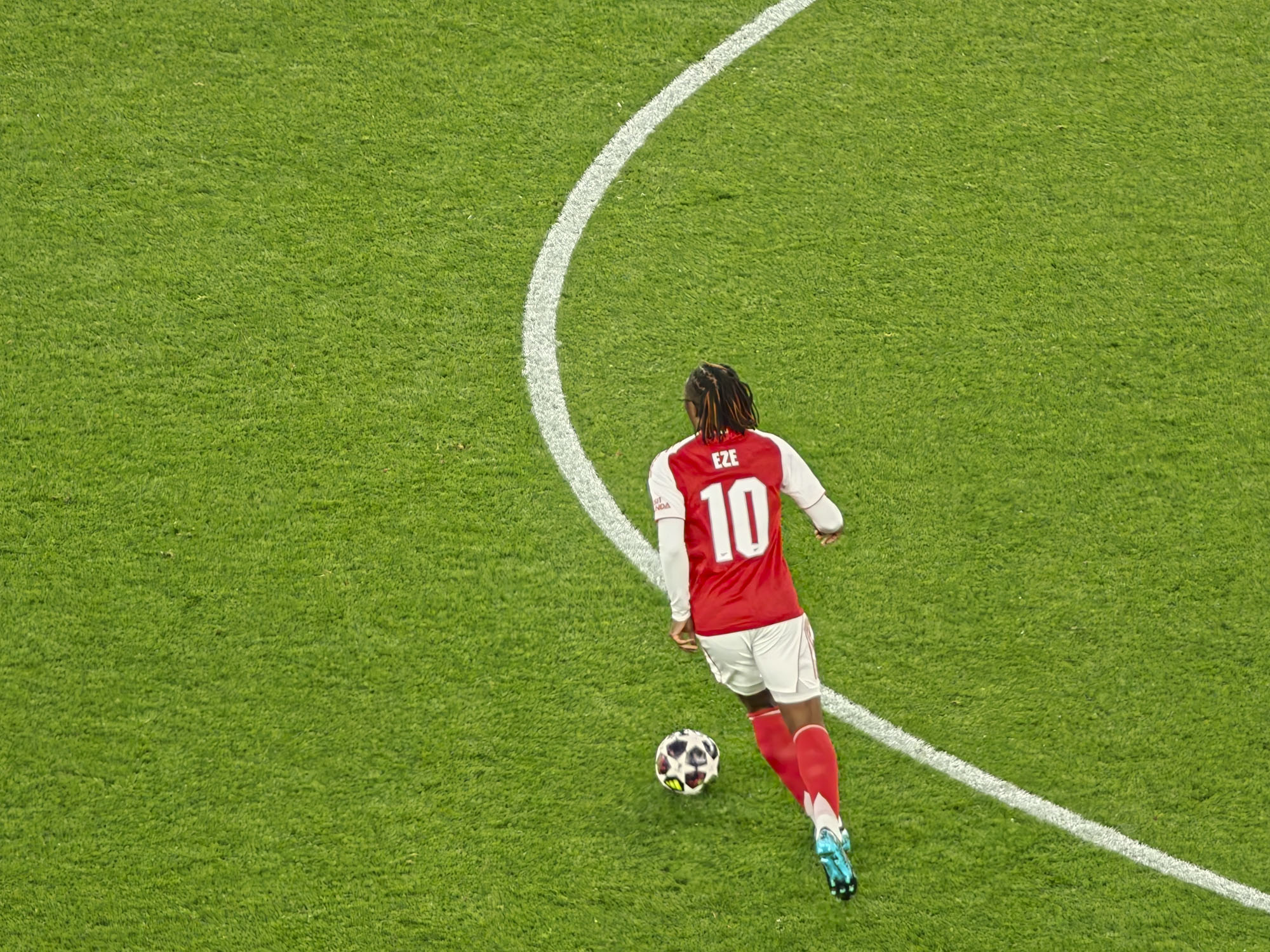 A Champions League soccer match between Arsenal and Atletico Madrid, as seen from the upper stand at the Emirates stadium, London. Zoomed in photos of the players