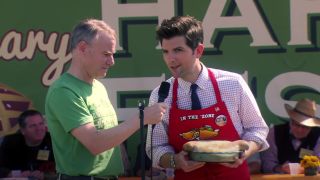 Adam Scott as Ben Wyatt, competing in the Pie-mary with a calzone