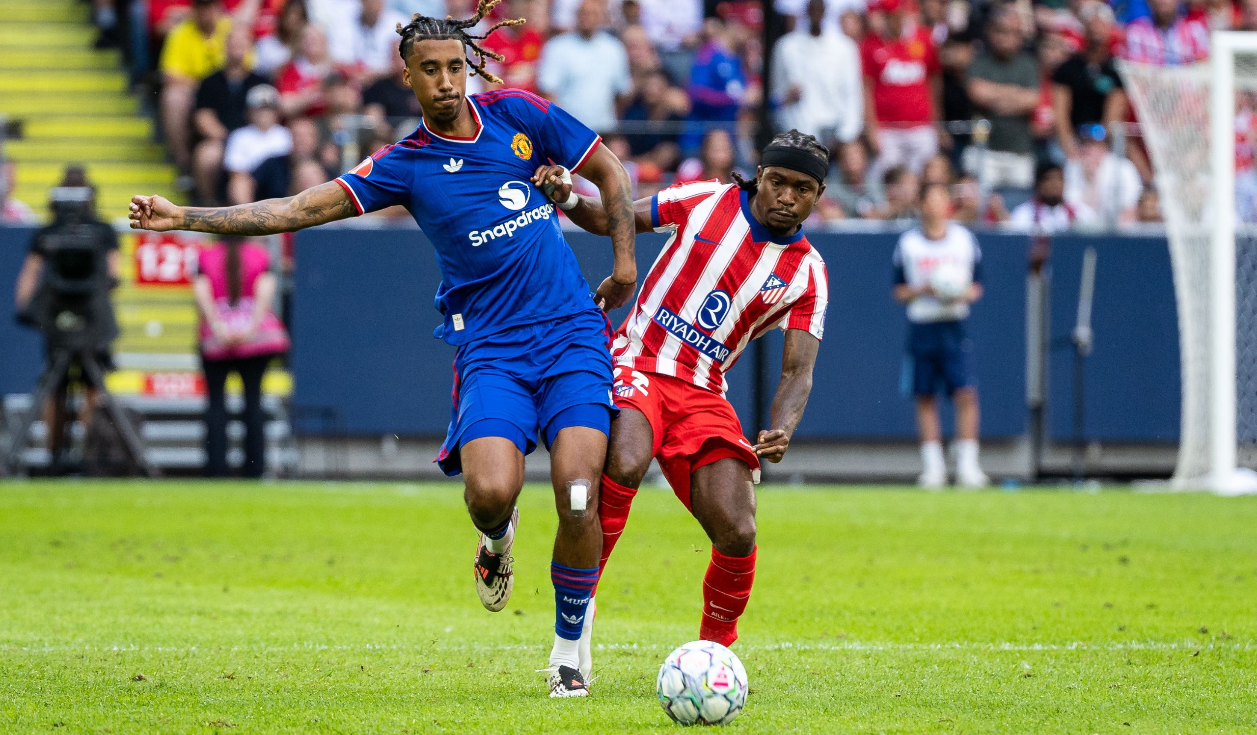 Leny Yoro of Manchester United against Ademola Lookman of Atletico de Madrid during the pre-season friendly match at Strawberry Arena on August 1, 2026 in Solna, Sweden