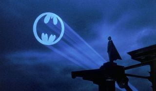 Batman Michael Keaton looks out at the Bat Signal