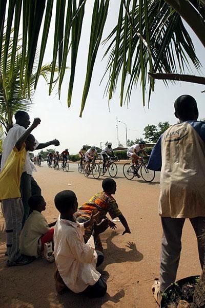 Fans cheer on riders of the Tour du Faso