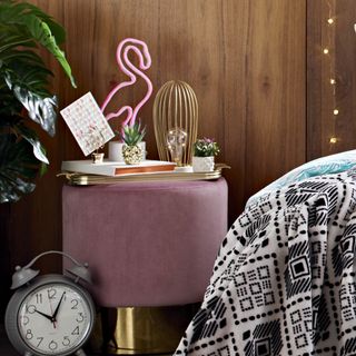 table with flamingo light wired caged light and retro alarm clock