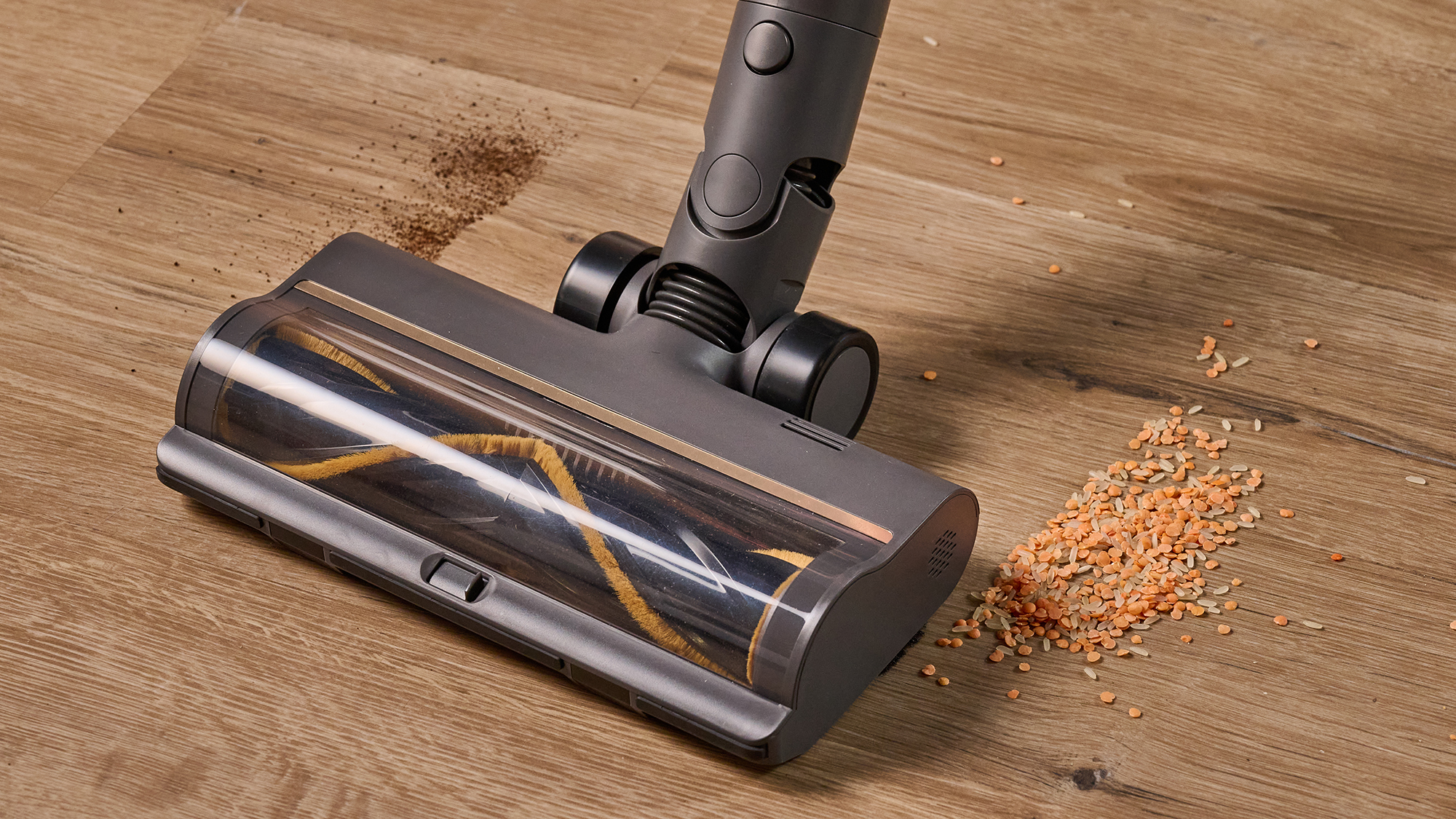 Dreame R20 vacuum clearing lentils and tea from a hard floor