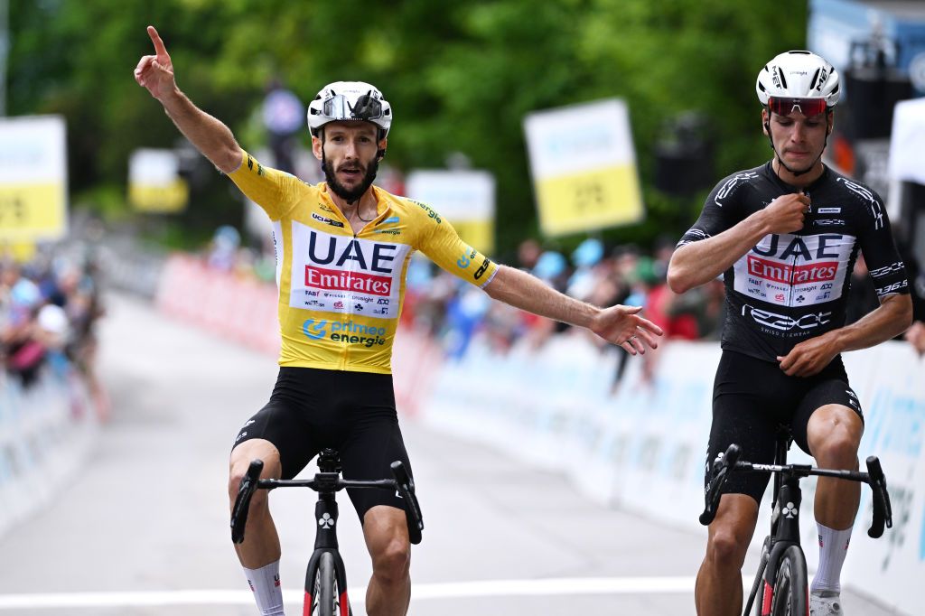 VILLARSSUROLLON SWITZERLAND JUNE 15 LR Stage winner Adam Yates of The United Kingdom and UAE Team Emirates Yellow Leader Jersey and Joao Almeida of Portugal and UAE Team Emirates Black Points Jersey cross the finish line during the 87th Tour de Suisse 2024 Stage 7 a 1182km stage from VillarssurOllon to VillarssurOllon 1248m UCIWT on June 15 2024 in VillarssurOllon Switzerland Photo by Tim de WaeleGetty Images