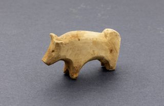 A small wooden carved ox or bull