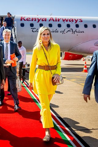 Queen Maxima of The Netherlands wears a yellow co-ord as she is welcomed at the airport by the Governor of Kisumu Peter Anyang Nyong on October 23, 2023 in Kisumu, Kenya. Queen Maxima visits Kenya in her capacity as United Nation Secretary Generals Special Advocate for Inclusive Finance for Development.