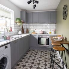kitchen makeover with grey units and green wall